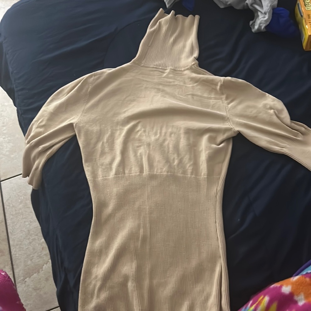 this is a nude, fitted turtle neck